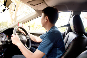 Asian men use mobile phones to find their way with a map GPS navigator.