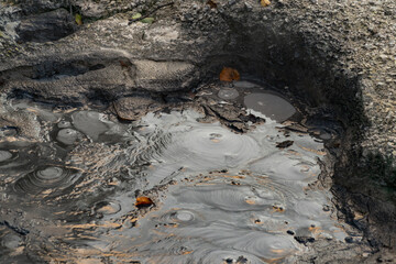 volcanic mud with reflection and bubbles