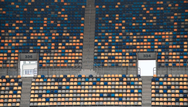 Empty football sport stadium seats during coronavirus pandemic without people