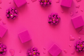 Pink gift boxes on a festive background.Tradition to congratulate on a holiday.