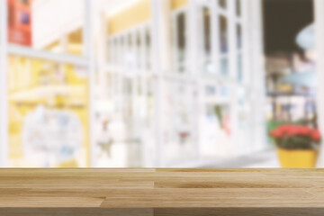 Obraz na płótnie Canvas Empty wooden board empty table in front of blurred background. Perspective brown wood over store background - can be used mockup for display or montage your products. copy space.
