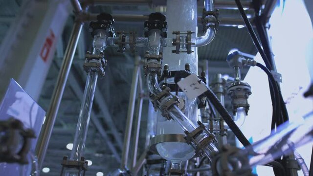 Water flows in a transparent pipe. Transparent pipe to show water flows inside the water supply system. Testing of pumps for oil flow