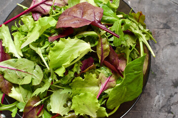 Arugula, spinach, greens close-up. Veganism and vegetarianism. Healthly food.