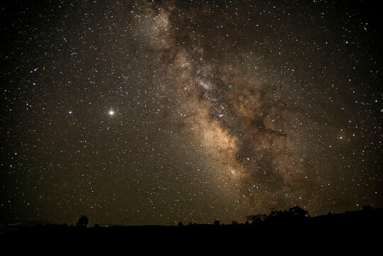 starry night sky above desert landscape © Zach