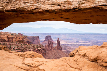 looking through a red arch in utah
