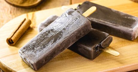 vegan chocolate popsicles, without added sugar with almond or coconut milk. Ice cream with organic...