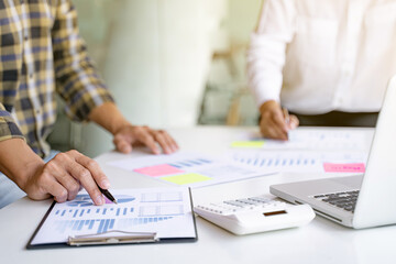 Financial inspector calculating a numbers in office room..