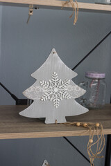 decorative wooden Christmas tree on a light background