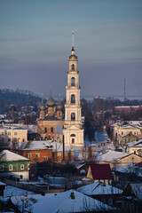 Fototapeta premium Old Russian city in winter. City of Yurievets in winter. Winter sleep. Snow-white bell tower of the city. Panorama of the old city.