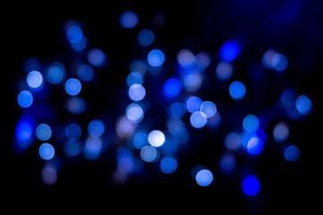 Perfect bokeh for a festive background. De-focused Abstract Light Circles. Bokeh spreads from side to side