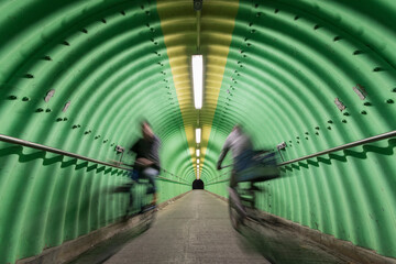 biker riding on bicycle in tunnel