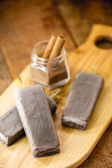 Fototapeta na wymiar vegan chocolate popsicles, without added sugar with almond or coconut milk. Ice cream with organic cocoa