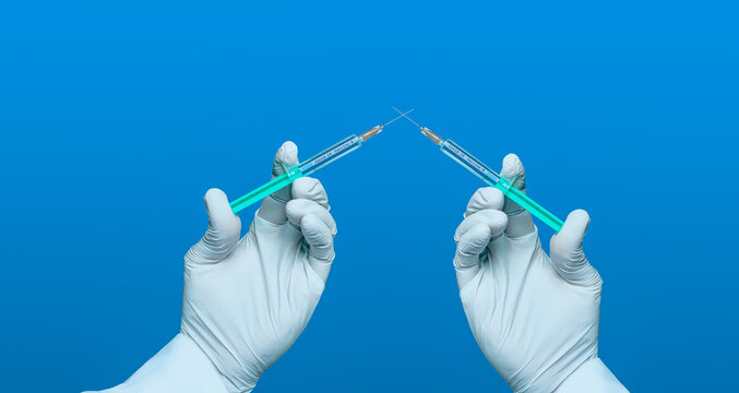 Contest for corona vaccine symbolically with two syringes dueling each other