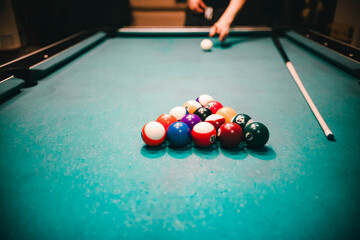 guy playing american pool