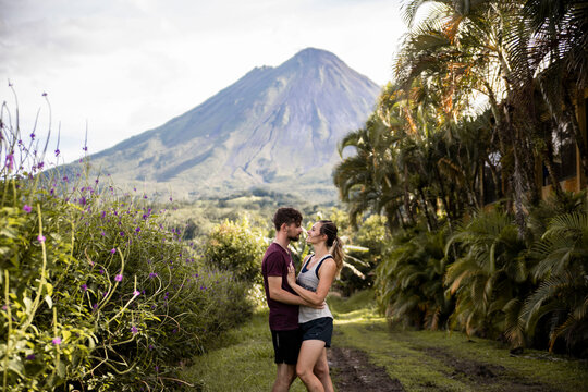 couple hiking in costa rica around volcano