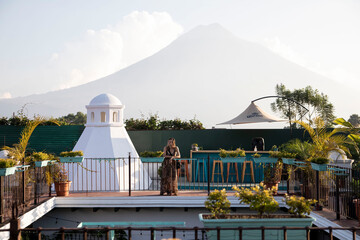 woman on patio overlooking antigua guatemala
