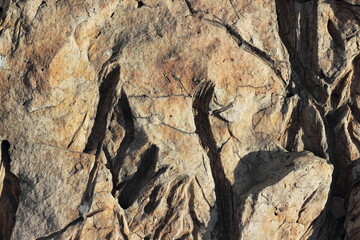 Natural cracked granite stone texture. Soft focus