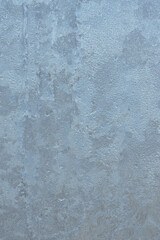 Beautiful natural background or texture of frozen transparent glass on the window in winter, extreme cold concept, vertical image, copy space for your design or text