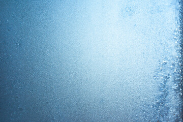 Beautiful natural background or texture of frozen transparent glass on the window in winter, strong cold concept, horizontal image, copy space for your design or text