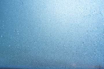 Beautiful natural background or texture of frozen transparent glass on the window in winter, strong cold concept, horizontal image, copy space for your design or text