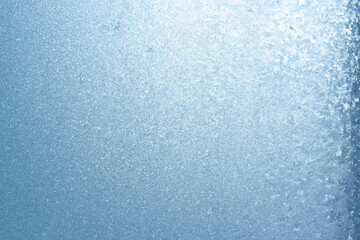 Beautiful natural background or texture of frozen transparent glass on the window in winter, strong cold concept, horizontal image, copy space for your design or text