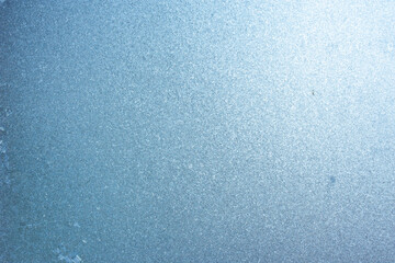 Beautiful natural background or texture of frozen transparent glass on the window in winter, strong...