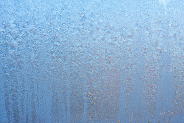 Beautiful natural background or texture of frozen transparent glass on the window in winter, strong cold concept, horizontal image, copy space for your design or text