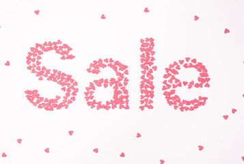 Sale, pink hearts on white background top view