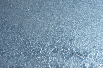 Beautiful natural background or texture of frozen transparent glass on the window in winter, strong cold concept, horizontal image, copy space for your design or text