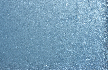 Beautiful natural background or texture of frozen transparent glass on the window in winter, strong cold concept, horizontal image, copy space for your design or text