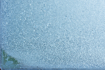 Beautiful natural background or texture of frozen transparent glass on the window in winter, strong cold concept, horizontal image, copy space for your design or text