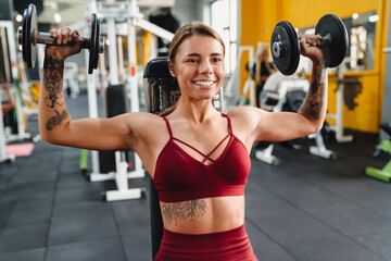 Fototapeta premium Woman fitness coach making sport exercise
