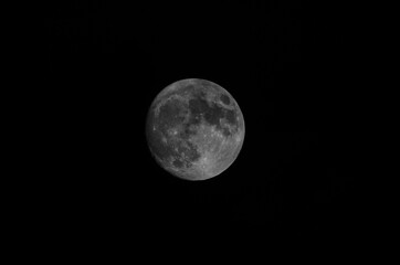full moon in the dark sky, black and white photo