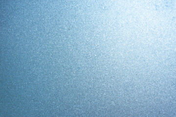 Completely frozen window on transparent glass. Clean background. Extreme low temperatures in winter. Water vapor condenses on cold window glass and freezes