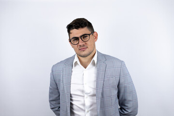 Fototapeta premium Business young man wearing a casual shirt over white background afraid and shocked with surprise and amazed expression, fear and excited face.