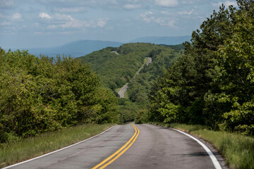 winding road through hills of arkansas and oklahoma