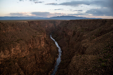 river going through deep canyon in taos new mexico