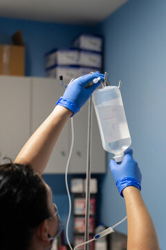 Nurse placing physiological saline solution