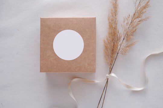 Round sticker mockup on gift box, wedding favor box and blank sticker label, adhesive address label, thank you tag.