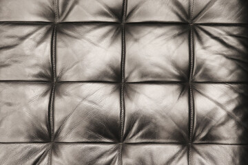 Naklejka premium The texture of the leather sofa. Upholstery. Interior design.