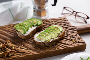 sliced avocado on toast bread with nuts