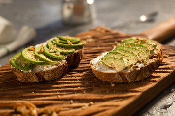 sliced avocado on toast bread with nuts