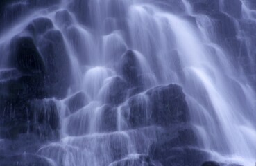 Fototapeta na wymiar water flowing from a waterfall