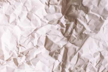 Crumpled white paper background.