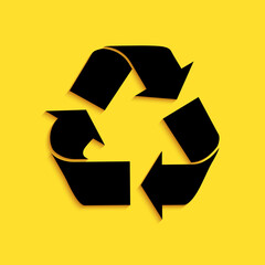 Black Recycle symbol icon isolated on yellow background. Circular arrow icon. Environment recyclable go green. Long shadow style. Vector.