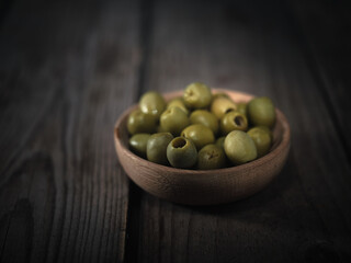 Olives in a wooden plate