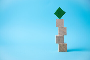 wooden cube stacking as stair step shape, mock up for create symbol or logo, business growth and management concept