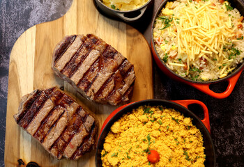 Rib Eye steak grilled in barbecue grill. With excellent accompaniment to meats.