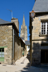Typical street and bell tower of basilica Notre-Dame du Roncier at Josselin, a commune in the Morbihan department in Brittany in north-western France