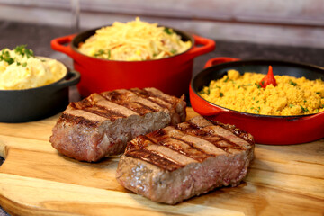 Rib Eye steak grilled in barbecue grill. With excellent accompaniment to meats.